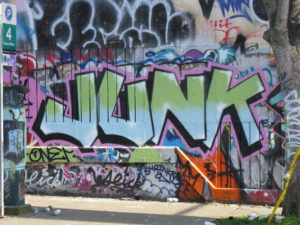 A graffiti wall art with a phrase “JUNK”