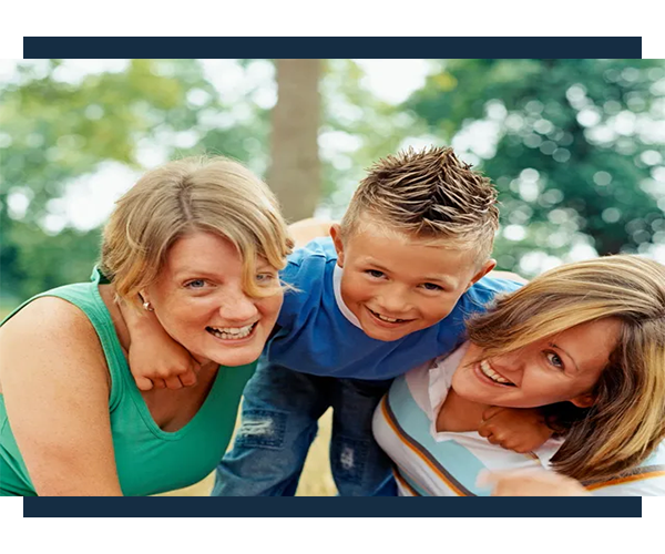 A group of people that are smiling for the camera