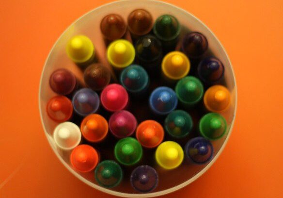 A bowl of colored pencils on the table