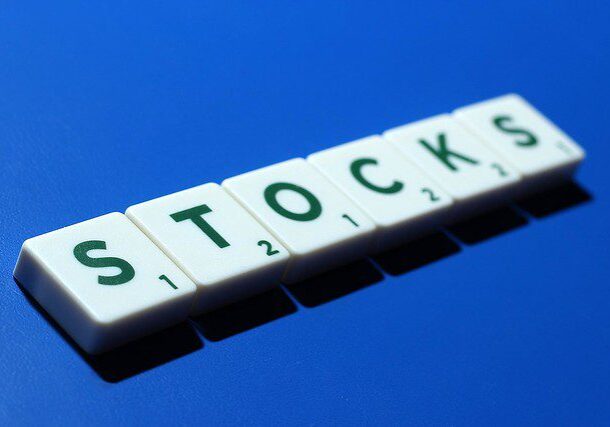 A close up of the word stocks spelled out in scrabble tiles