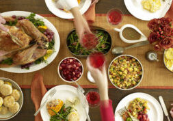 A table filled with lots of food and wine.